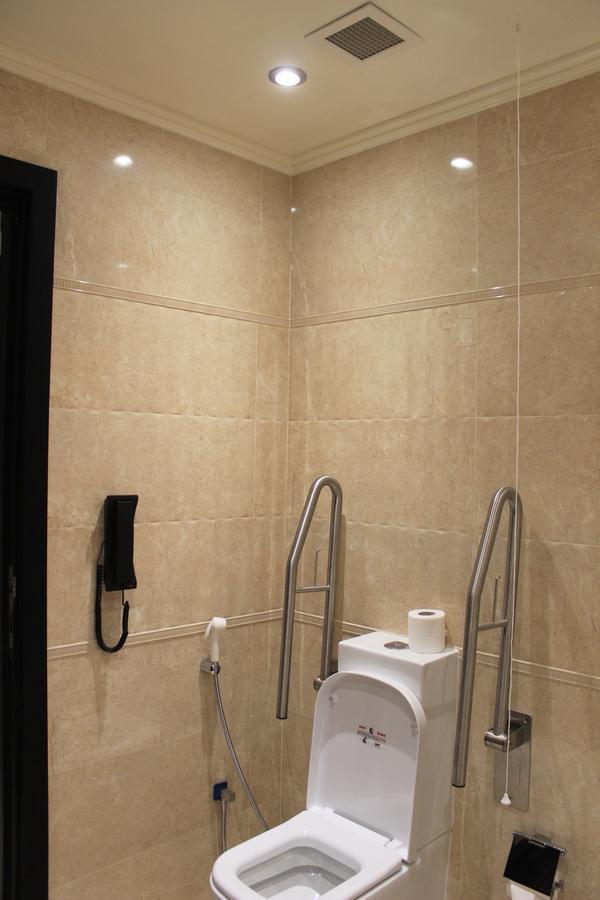 Tio Sea Resort Al Khor Exteriör bild A toilet with a grab rail